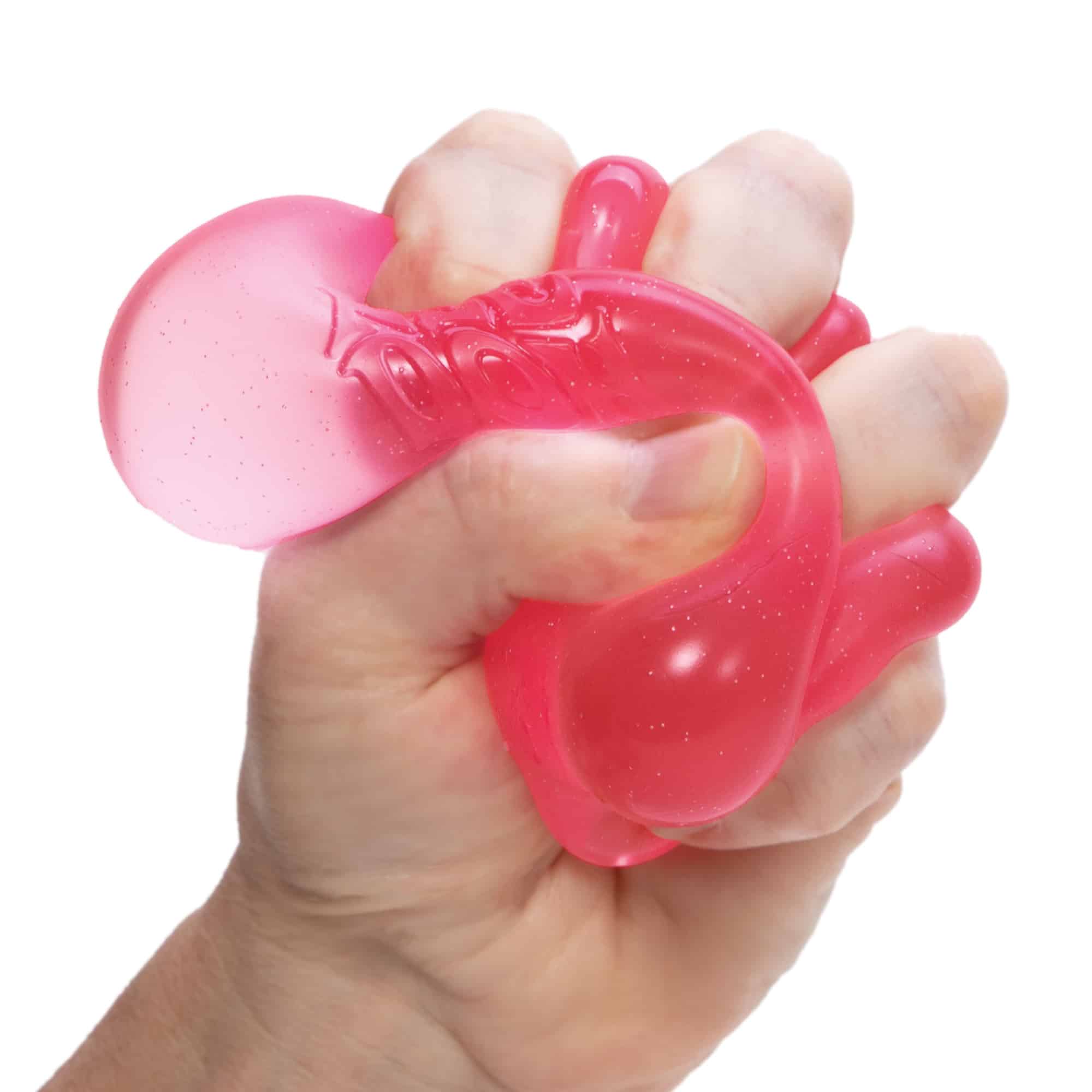 NeeDoh Nice Cube Pink Squeezed in Hand